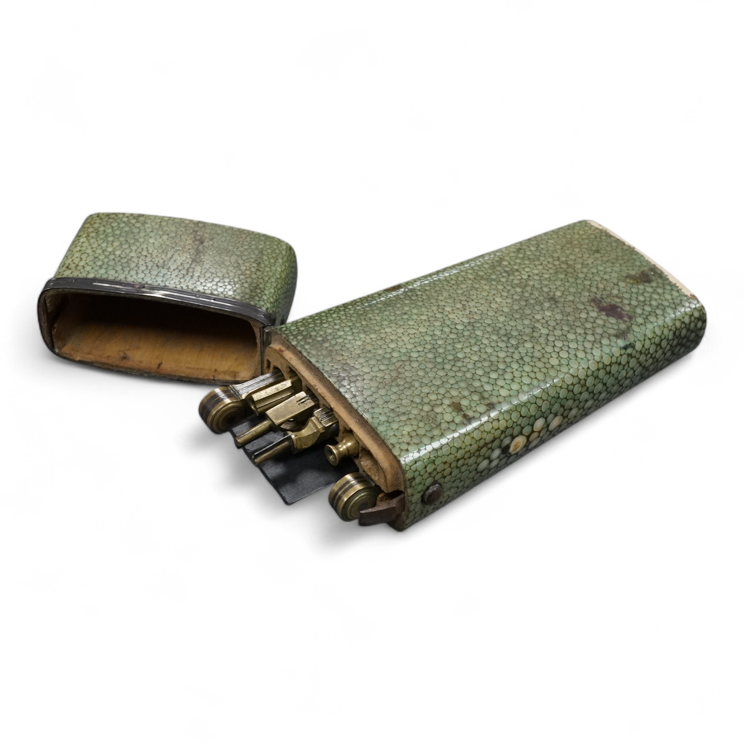 A Georgian draftsman’s set in a shagreen case, with fitted interior containing drawing instruments (some missing), 17.5cm high.